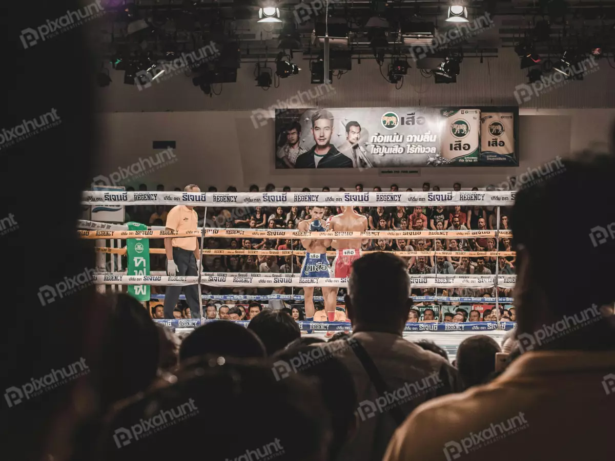 Free Premium Stock Photos A boxing match on fighters are in the ring, and the referee is standing between them