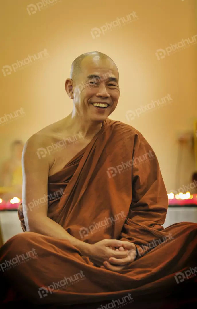 Free Premium Stock Photos A Buddhist monk in a sitting meditation posture And Look Happy