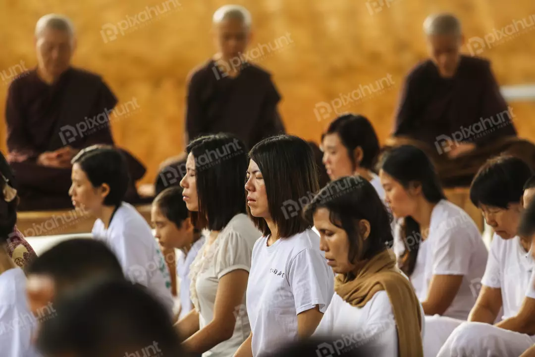 Free Premium Stock Photos A group of people meditating in a temple