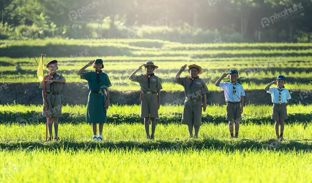 Free Premium Stock Photos A group of six children in a field, dressed in green scout uniforms