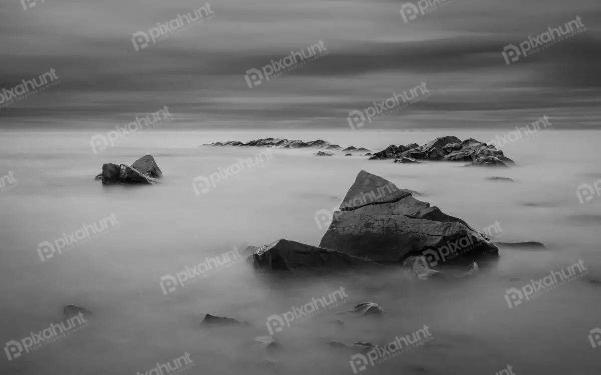 Free Premium Stock Photos a large rock in the fog