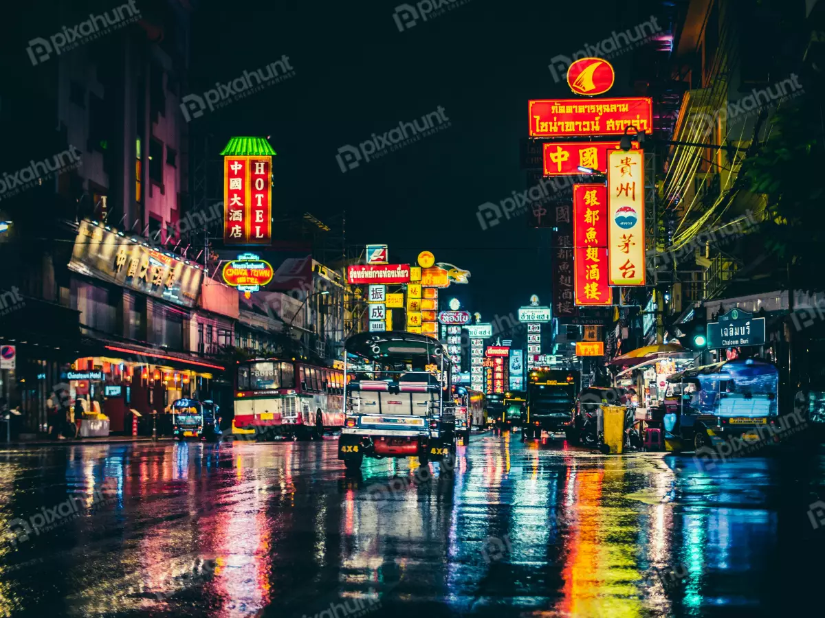 Free Premium Stock Photos A street scene in Bangkok Thailand and It is night time with the street is wet from the rain