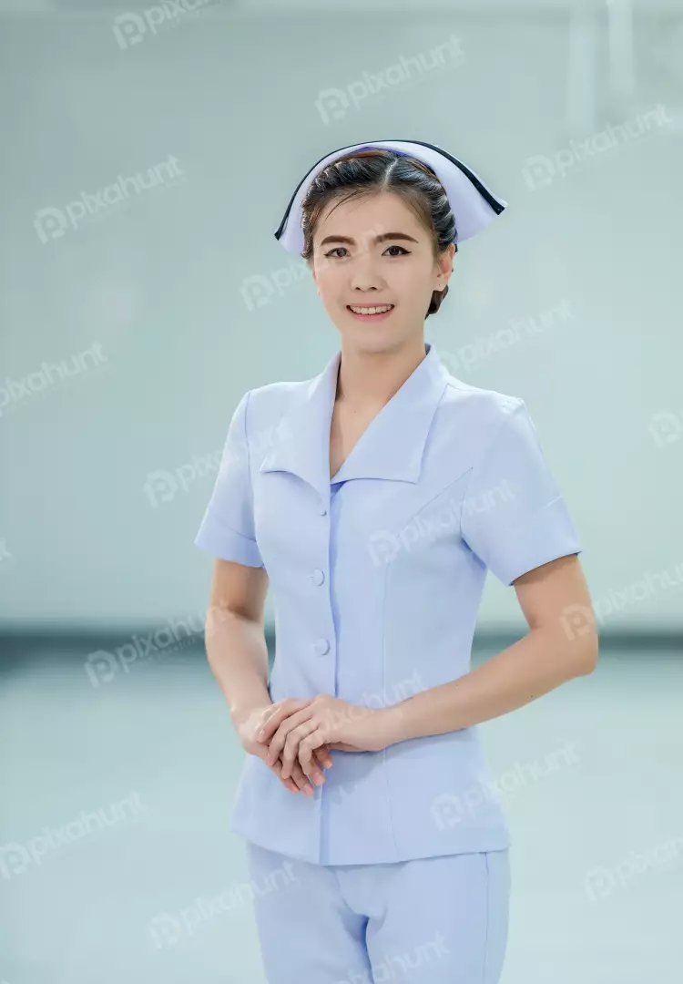 Free Premium Stock Photos A young female nurse wearing a blue uniform