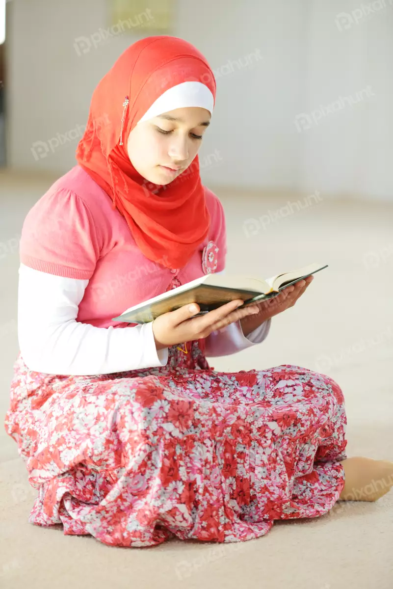 Free Premium Stock Photos A young Muslim Girl Reading Islamic Holy Quran