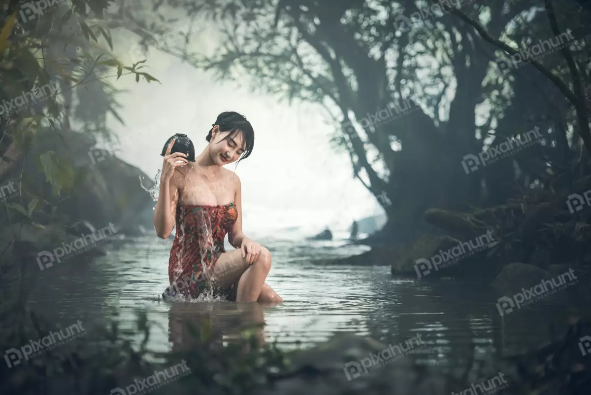 Free Premium Stock Photos A young woman bathing in a river