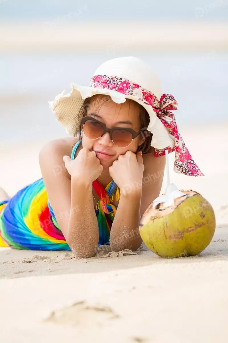 Free Premium Stock Photos A young woman lying on the beach
