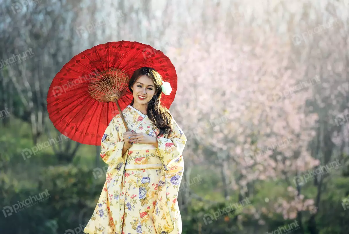 Free Premium Stock Photos Beautiful woman wearing a traditional Japanese kimono and long dark hair is left out and girl is holding a red umbrella