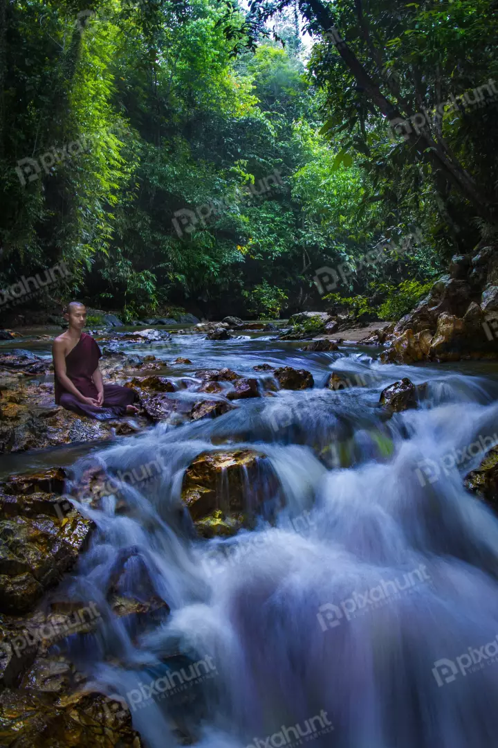 Free Premium Stock Photos Buddha monk practice meditation with waterfall
