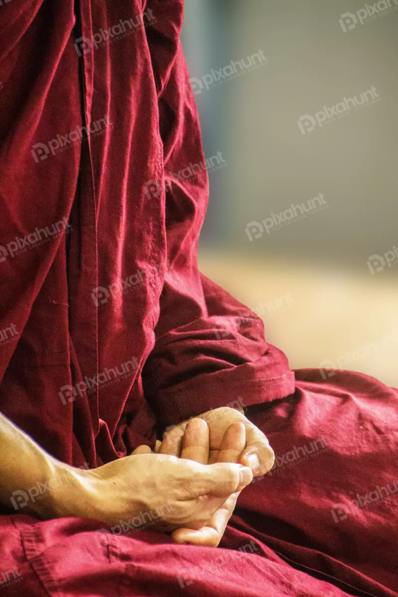 Free Premium Stock Photos Buddhist monk meditate to calm the mind. Focus on placing hands in meditation.