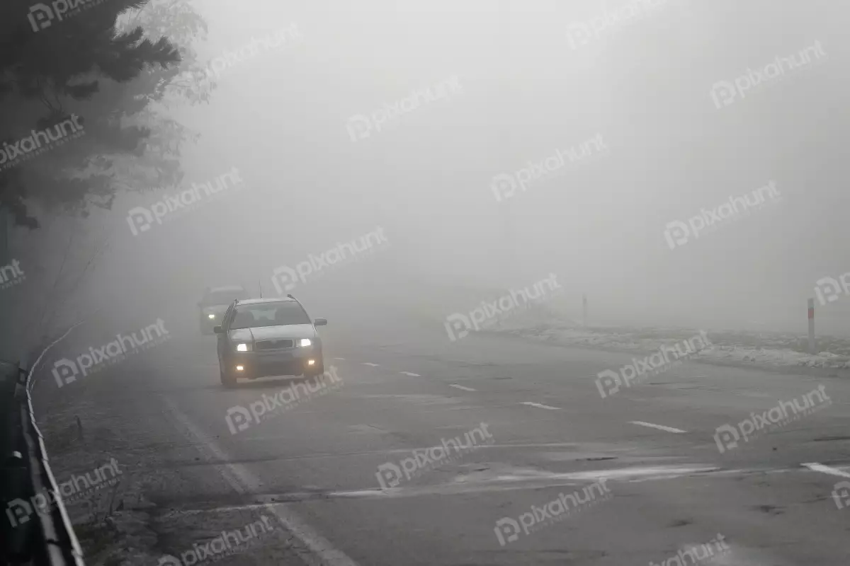 Free Premium Stock Photos Cars in the fog bad winter weather and dangerous automobile traffic on the road light vehicles in fog