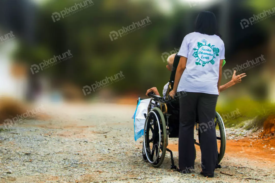 Free Premium Stock Photos Disabled handicapped man in wheelchair and care helper walking on trail