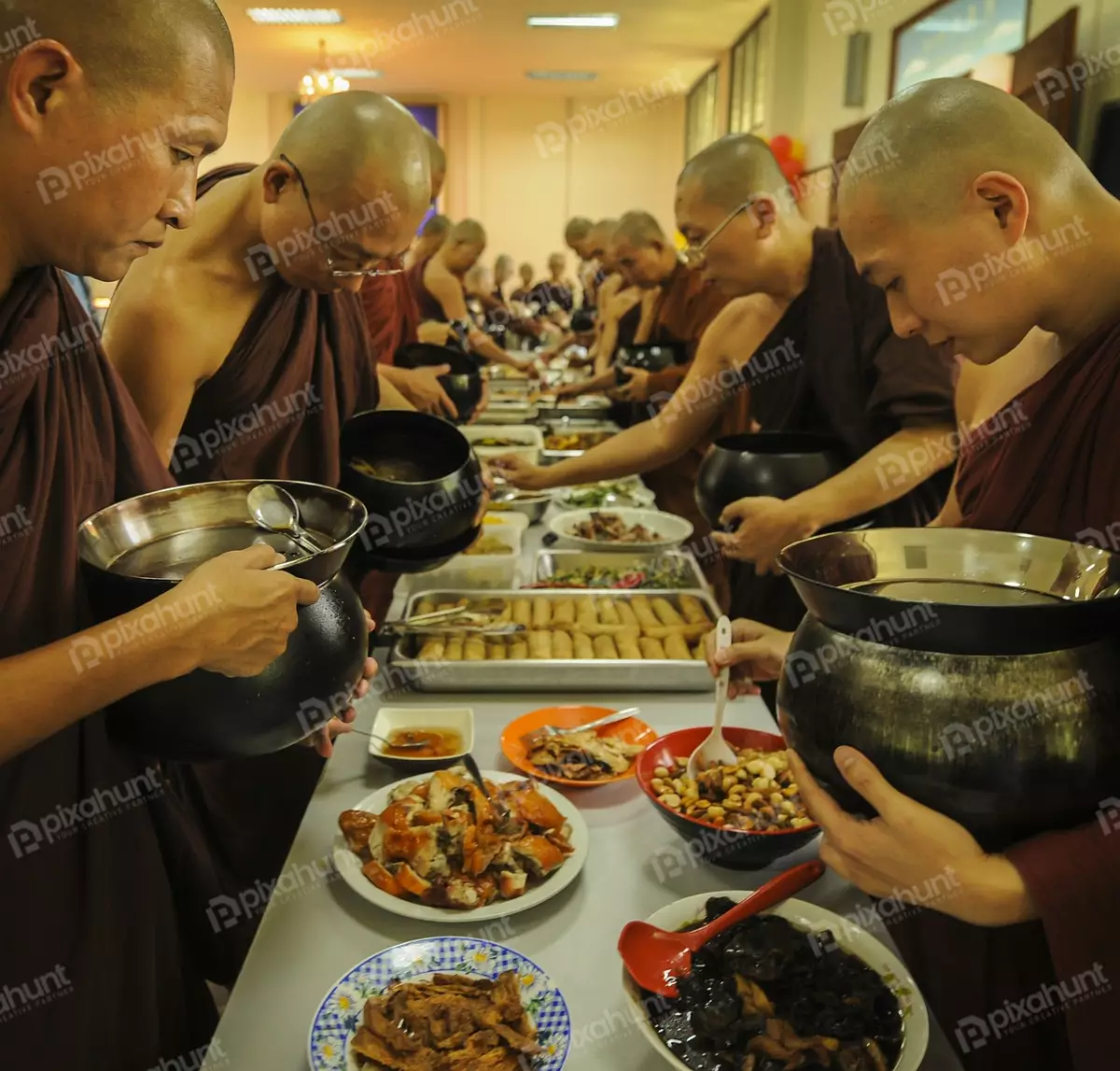 Free Premium Stock Photos Group of Buddhist monks in Thailand holding a bowl