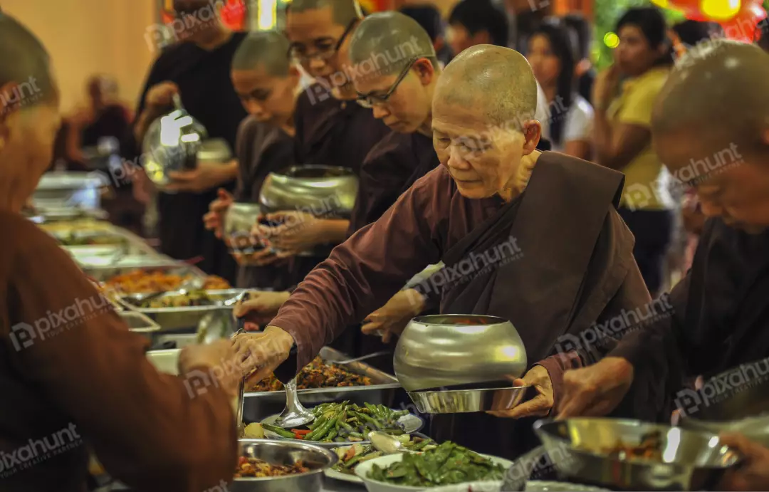Free Premium Stock Photos group of Buddhist nuns having a meal