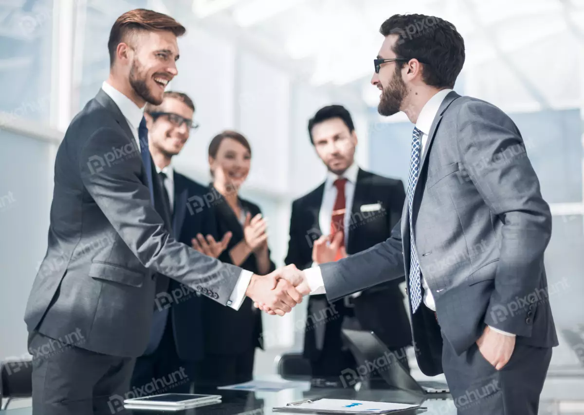 Free Premium Stock Photos Handshake business partners standing | handshake of business people in a modern officeconcept of partnership