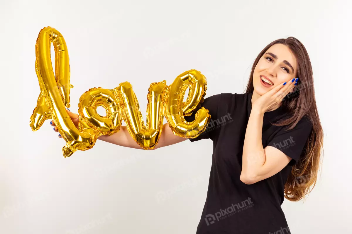 Free Premium Stock Photos Holding balloon and seems grateful young lady | love balloon 