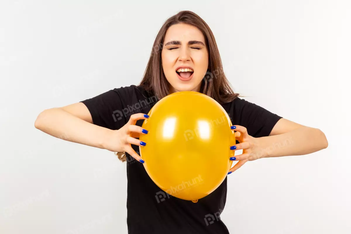 Free Premium Stock Photos Holding orange balloon and screaming a Girl
