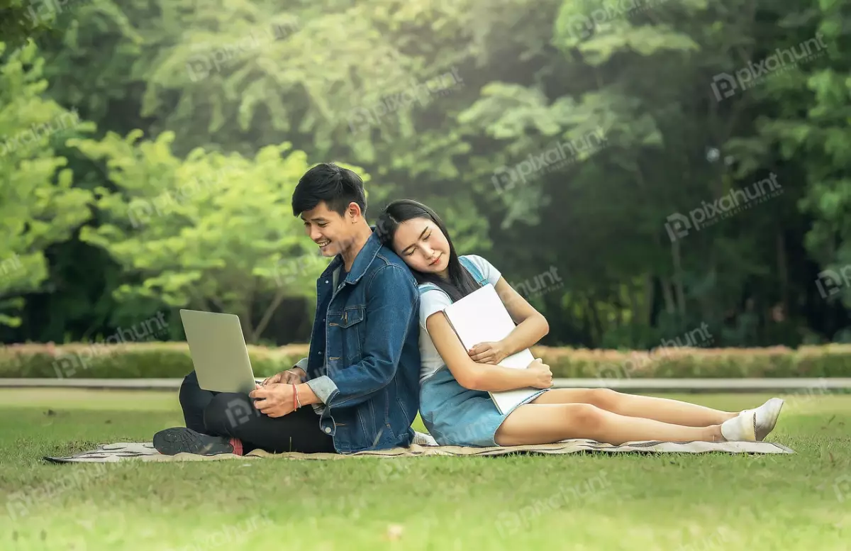Free Premium Stock Photos Man and woman sitting on a blanket in a park