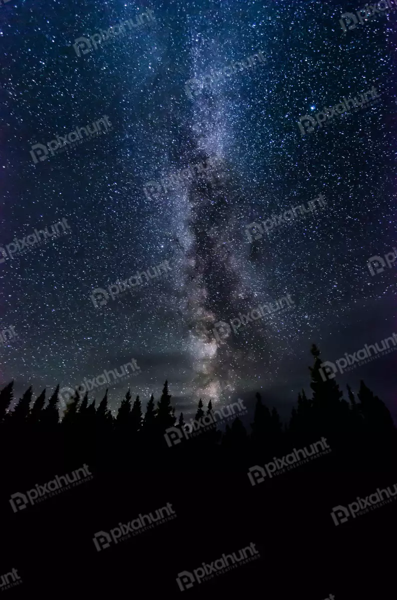 Free Premium Stock Photos Milky Way stretches across the sky in a brilliant display of stars and dust