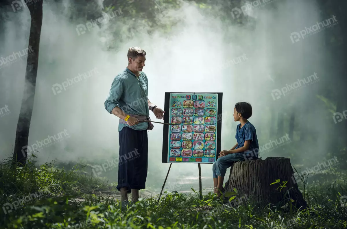 Free Premium Stock Photos Portrait of a teacher and a student in a rural setting and man with short brown hair and a beard