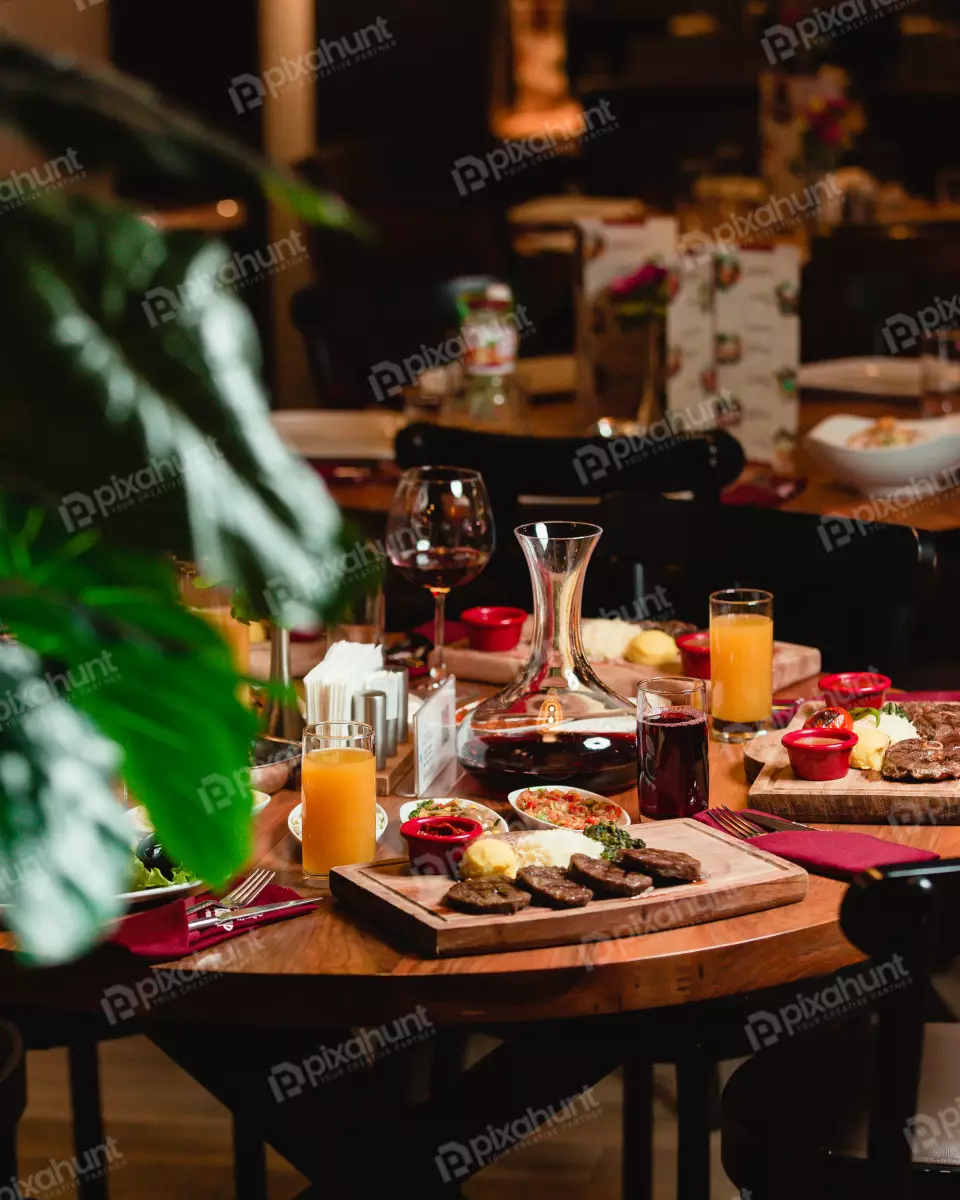 Free Premium Stock Photos Table On foods With soft drinks | A dinner table with foods and soft drinks in a restaurant