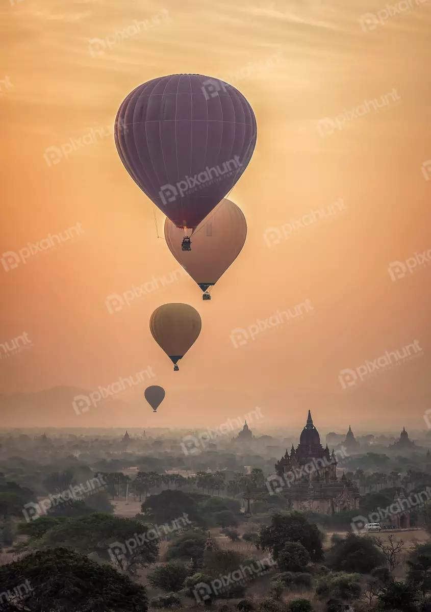 Free Premium Stock Photos The balloon is at a high altitude, which gives the viewer a bird's eye view of the landscape below