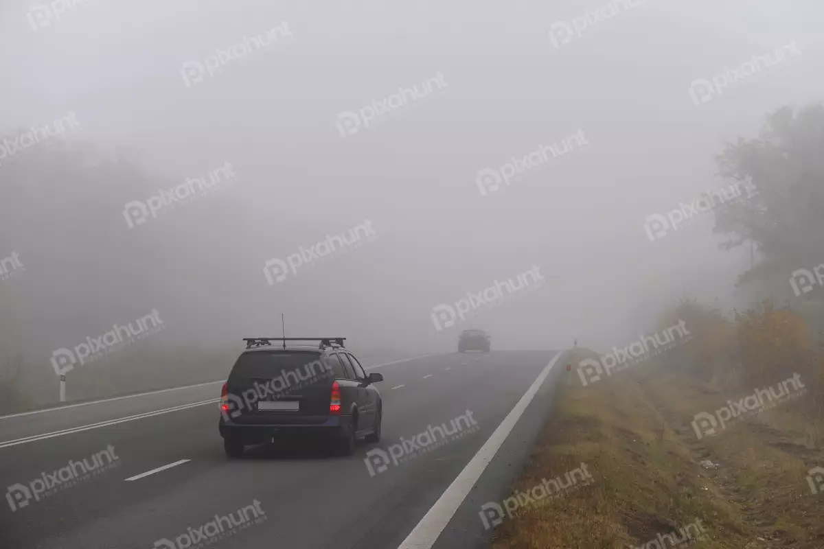 Free Premium Stock Photos The fog autumn landscape dangerous road traffic in winter season | Car on the road