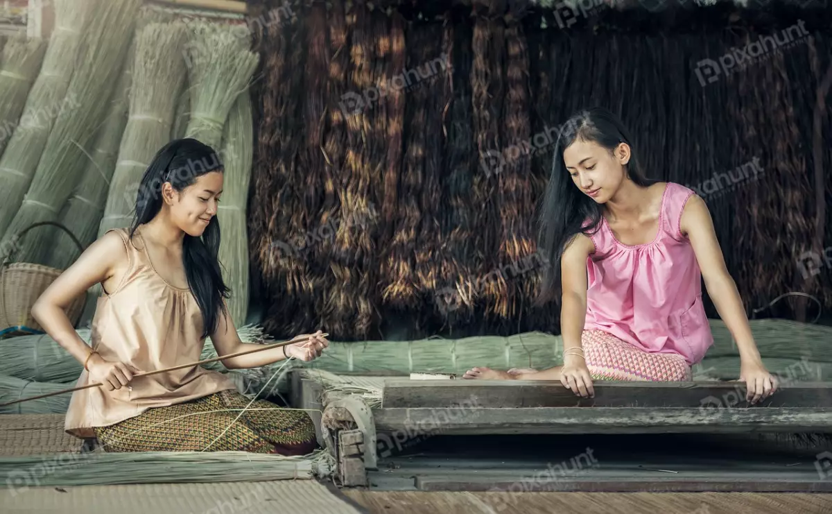 Free Premium Stock Photos Two young women sitting on the floor in a traditional Thai house