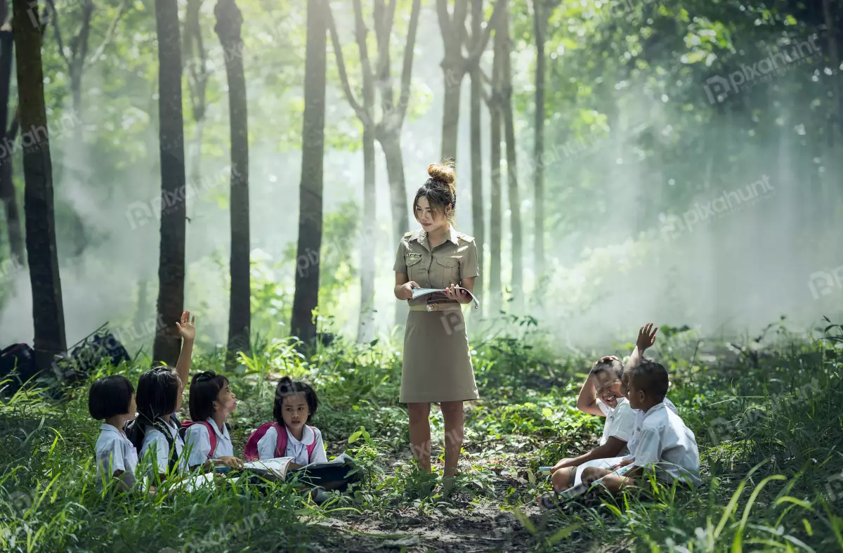 Free Premium Stock Photos Woman teacher and her students in a forest is wearing a brown uniform and the students are wearing white shirts and black pants