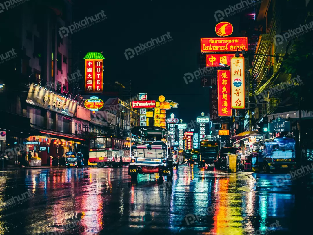 Free Premium Stock Photos A street scene in Bangkok Thailand and It is night time with the street is wet from the rain