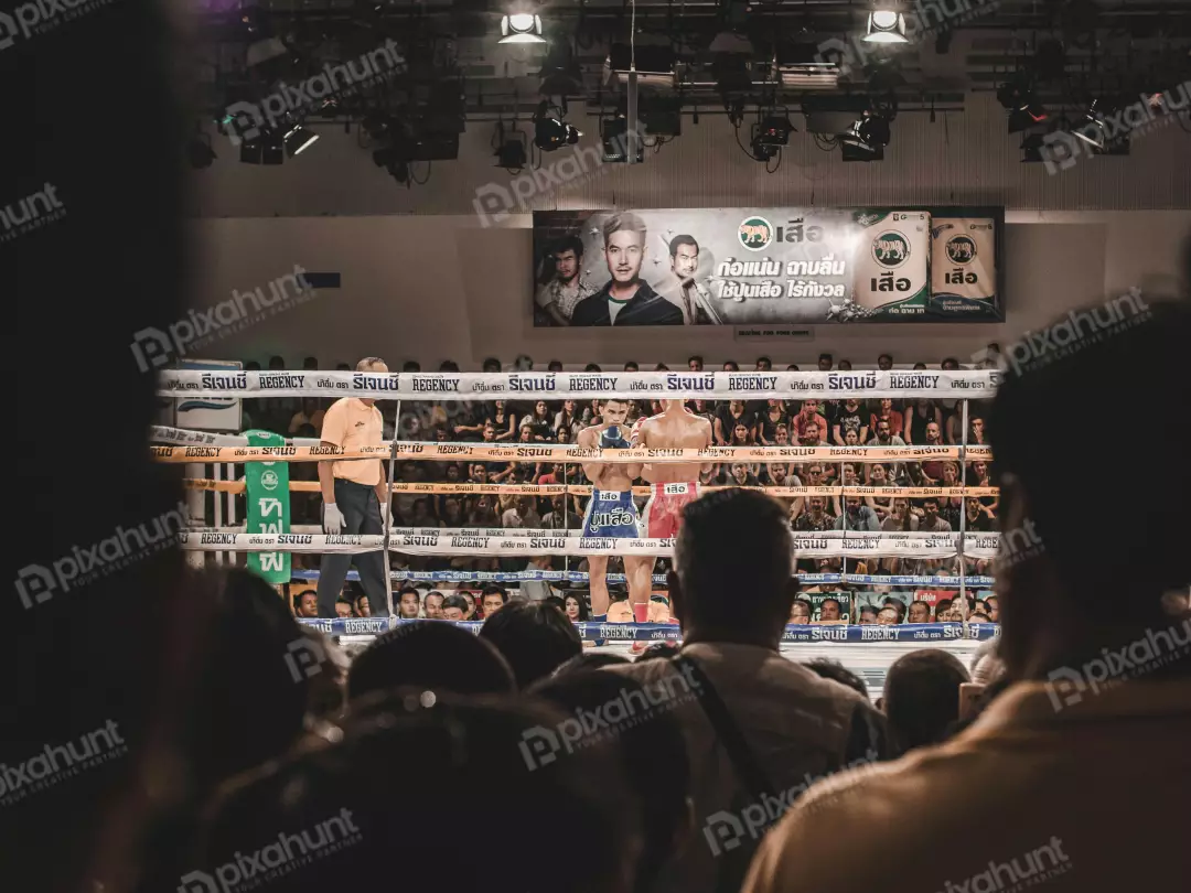 Free Premium Stock Photos A boxing match on fighters are in the ring, and the referee is standing between them