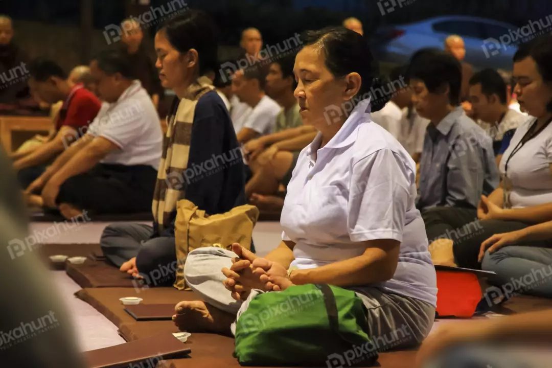 Free Premium Stock Photos A group of people sitting on the floor in a meditation pose