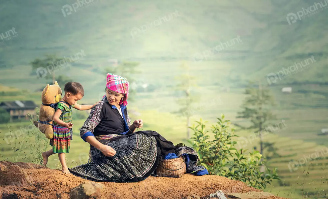 Free Premium Stock Photos A beautiful portrait of a mother and her child and mother is wearing a traditional Vietnamese hat and clothing, and the child is wearing a colorful outfit