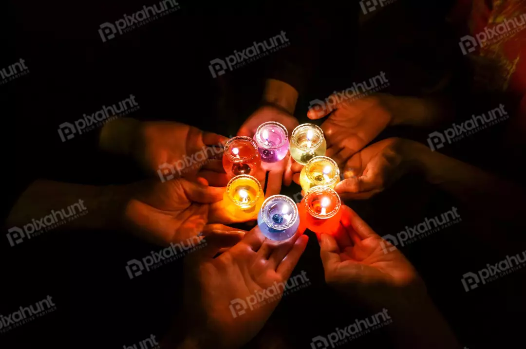 Free Premium Stock Photos prayer candles in hands in the dark