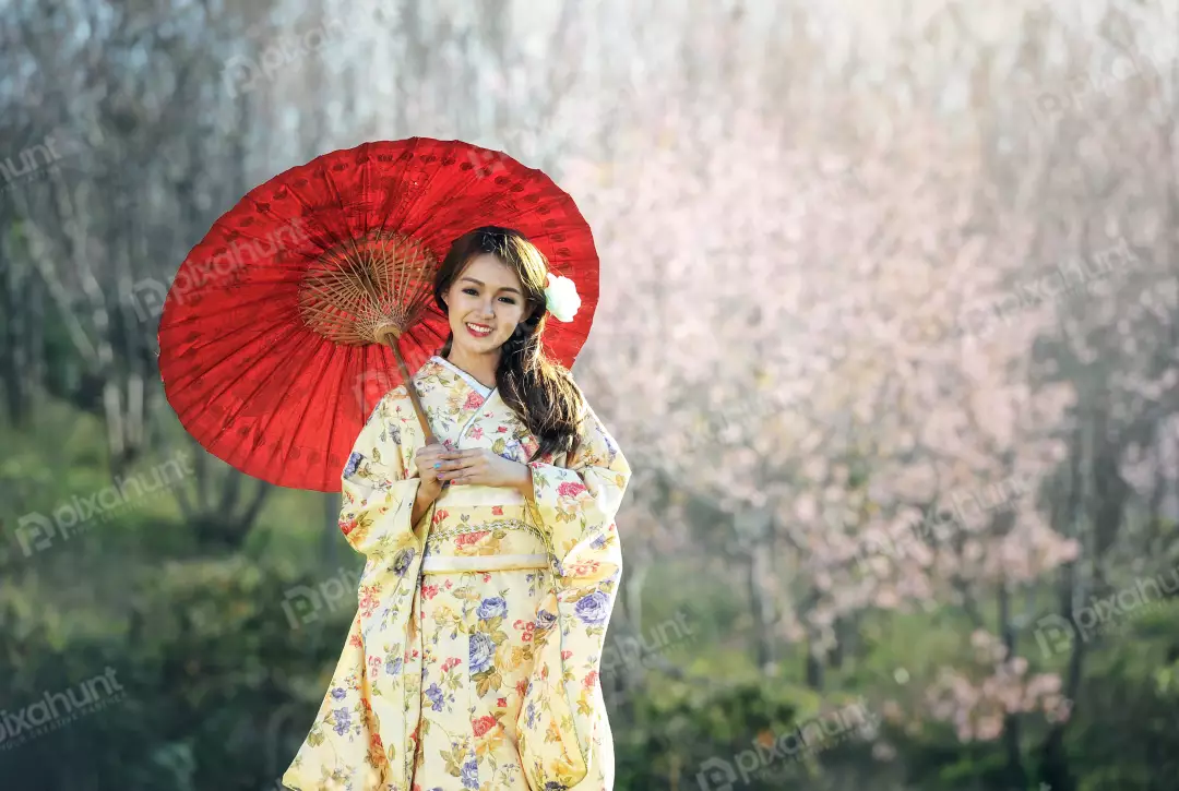 Free Premium Stock Photos Beautiful woman wearing a traditional Japanese kimono and long dark hair is left out and girl is holding a red umbrella