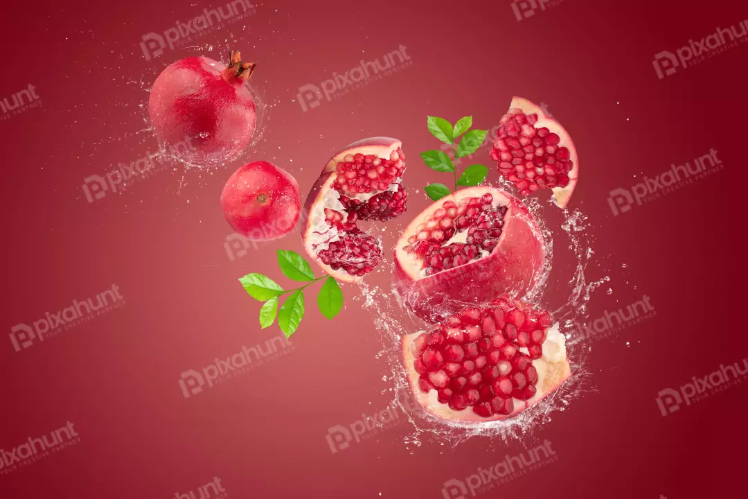 Free Premium Stock Photos Water splashing on Ripe pomegranate fruit on red background