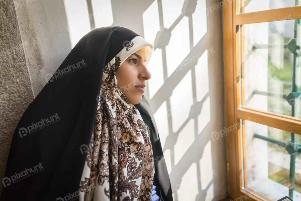 Free Premium Stock Photos Muslim Woman reading quran islamic holy book after praying