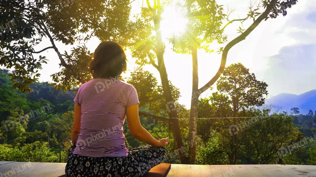 Free Premium Stock Photos Slightly elevated angle, looking down on a woman who is sitting in a yoga pose on a wooden platform