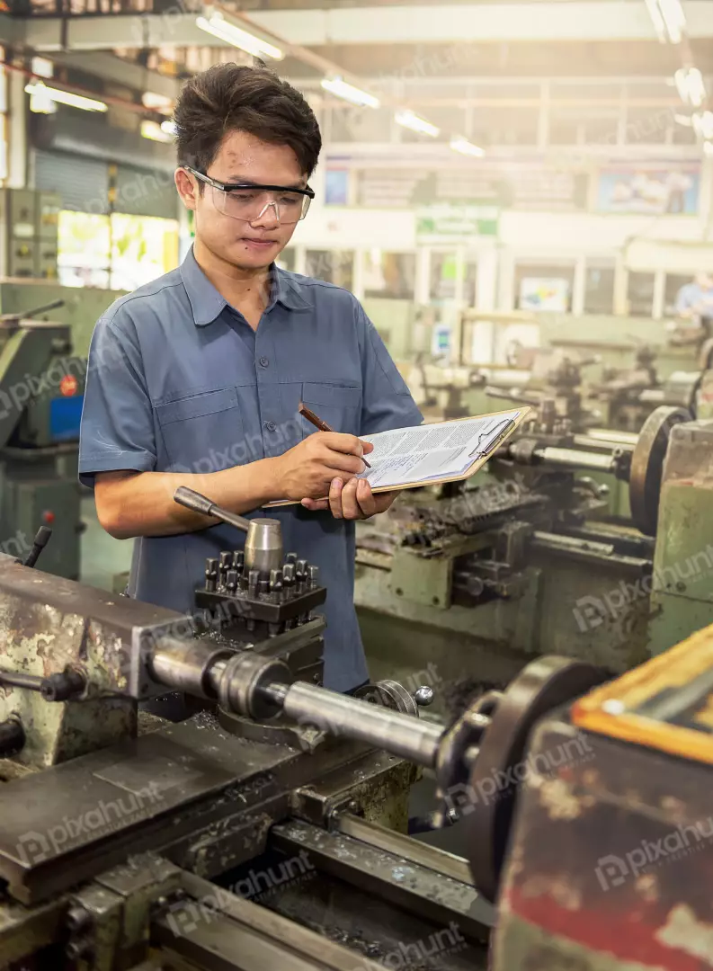 Free Premium Stock Photos A man engineer in a blue uniform and safety glasses