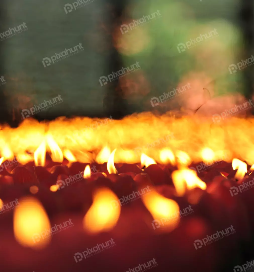 Free Premium Stock Photos a close-up of a group of candles