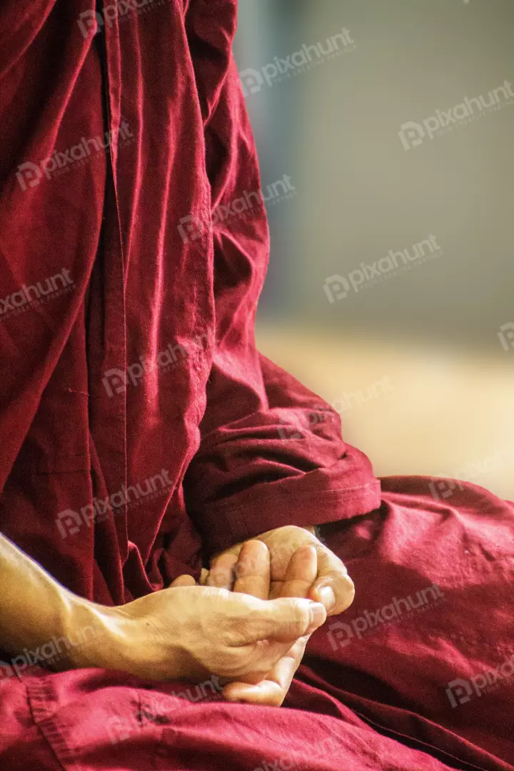 Free Premium Stock Photos Buddhist monk meditate to calm the mind. Focus on placing hands in meditation.