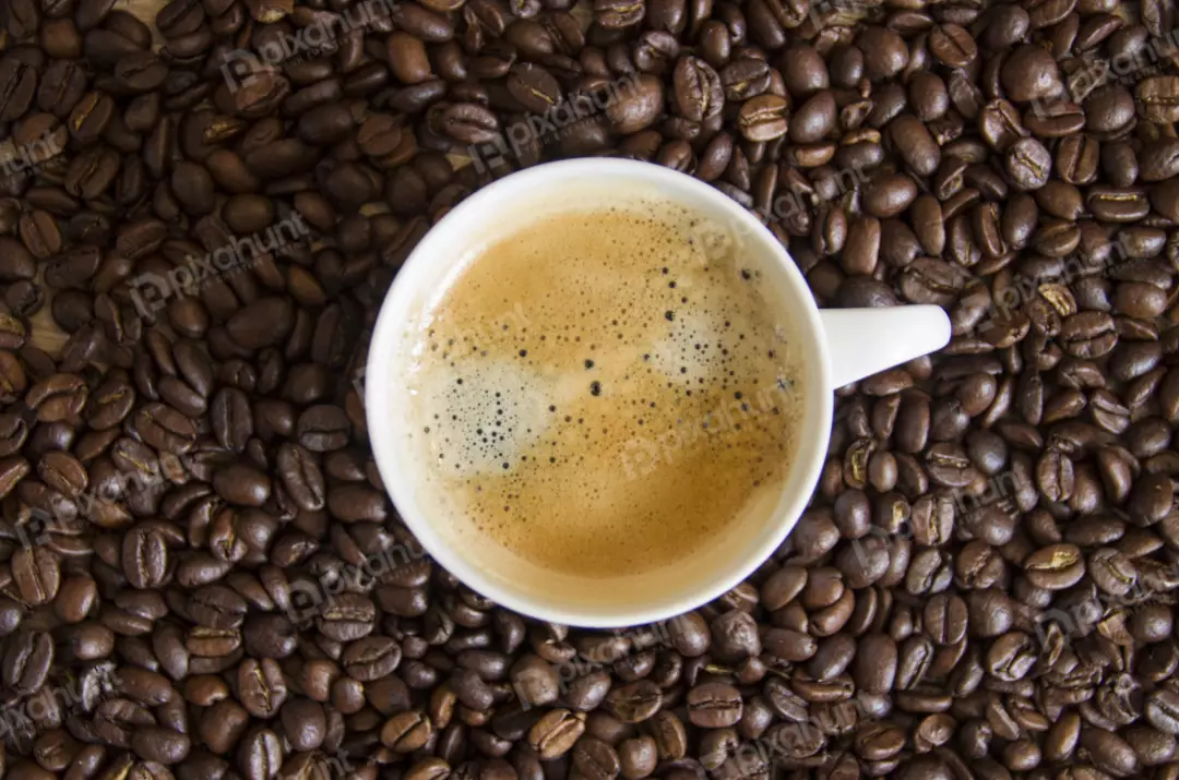 Free Premium Stock Photos A close-up of a white coffee cup filled with coffee