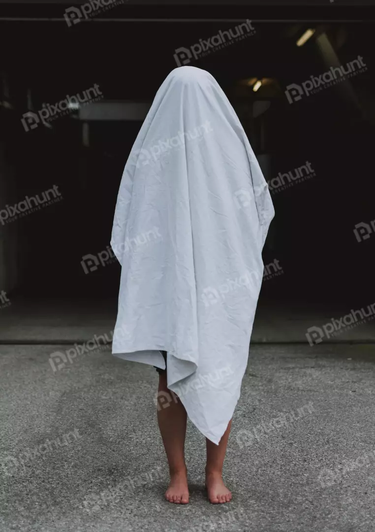 Free Premium Stock Photos The person is wearing a white sheet and looking straight at the camera