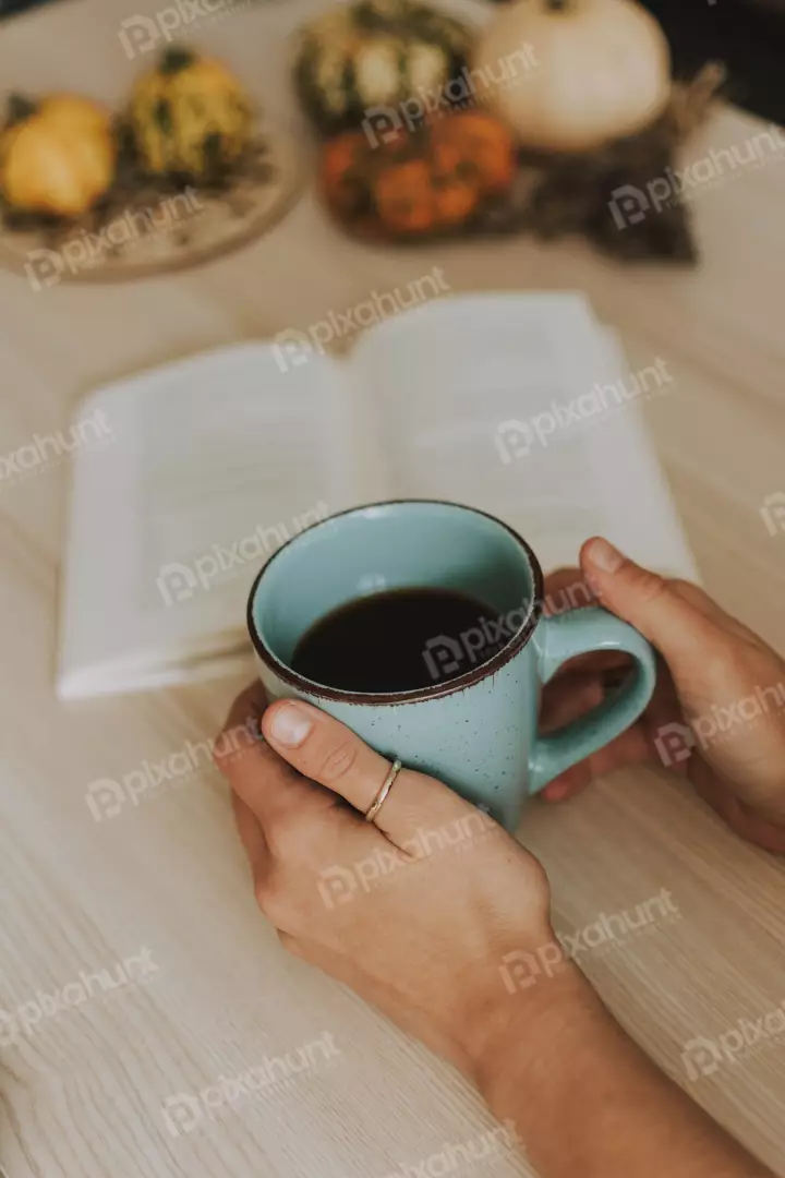 Free Premium Stock Photos a close-up of a woman's hands holding a blue mug of coffee