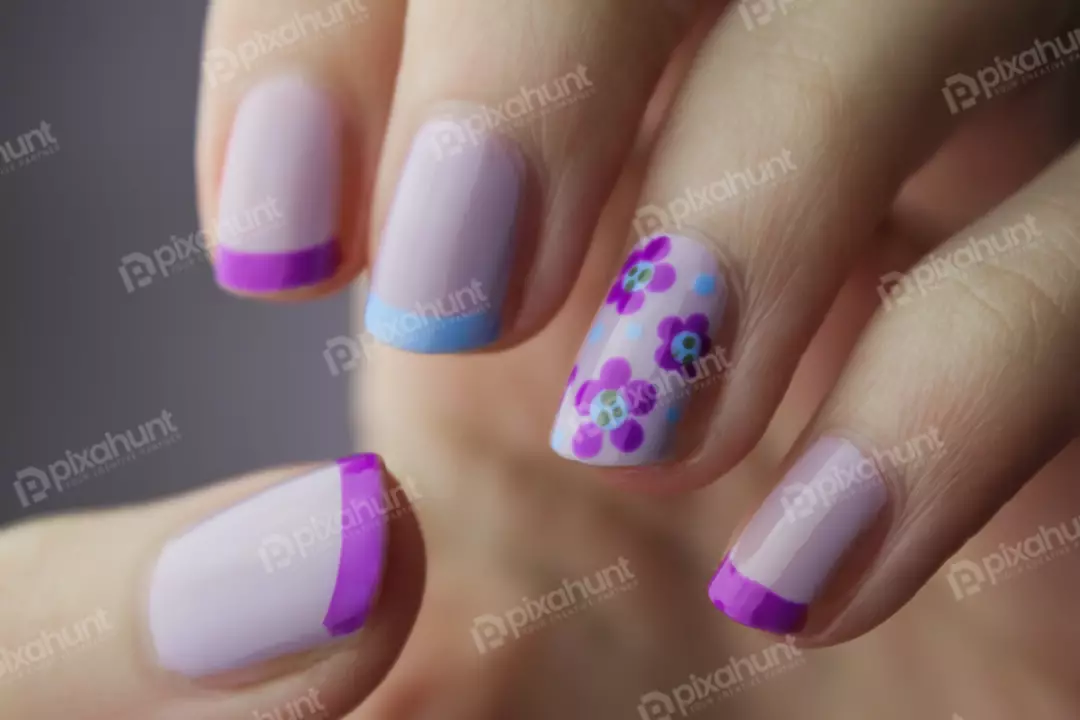 Free Premium Stock Photos The woman's nails are painted with a light purple polish