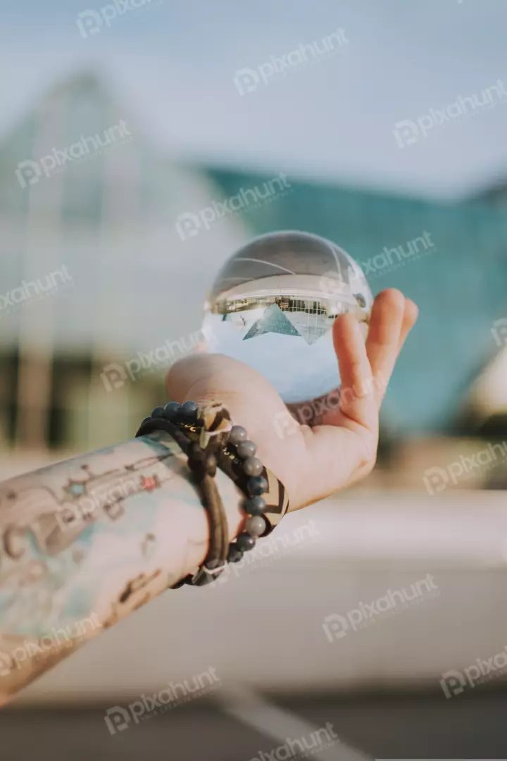 Free Premium Stock Photos a close-up of a hand holding a glass ball