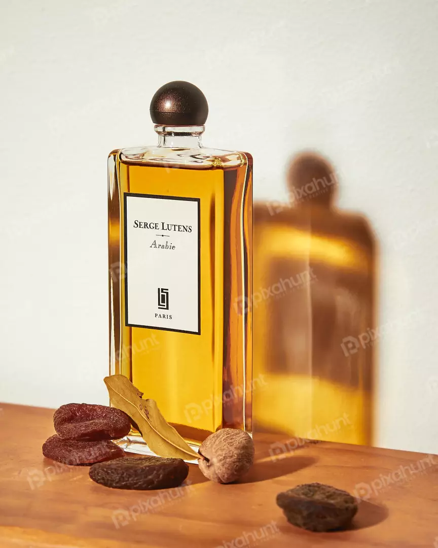 Free Premium Stock Photos bottle is labeled with the name of the perfume, Serge Lutens Arabie and the city where it was made Paris.