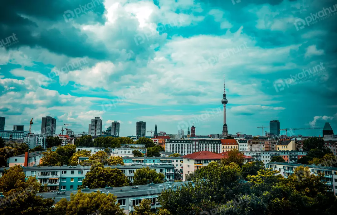 Free Premium Stock Photos In berlin City sky is a stormy blue, with dark clouds rolling in