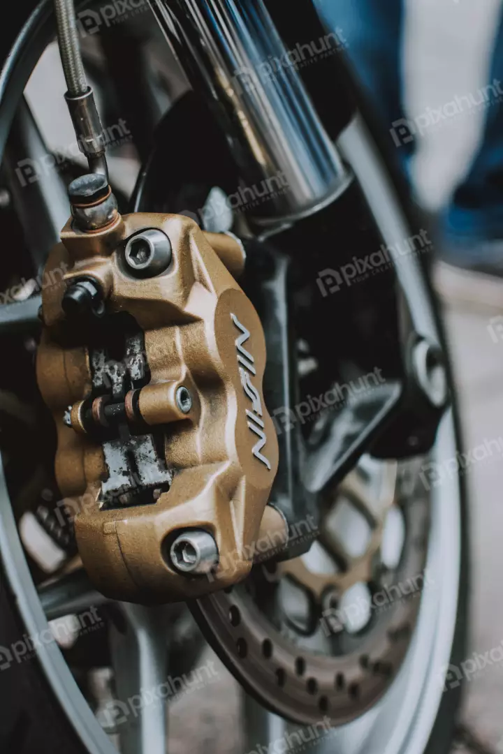 Free Premium Stock Photos a close up of a motorcycle's front brake caliper