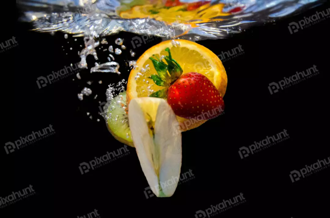 Free Premium Stock Photos A high-quality photo of a variety of fruits submerged in water