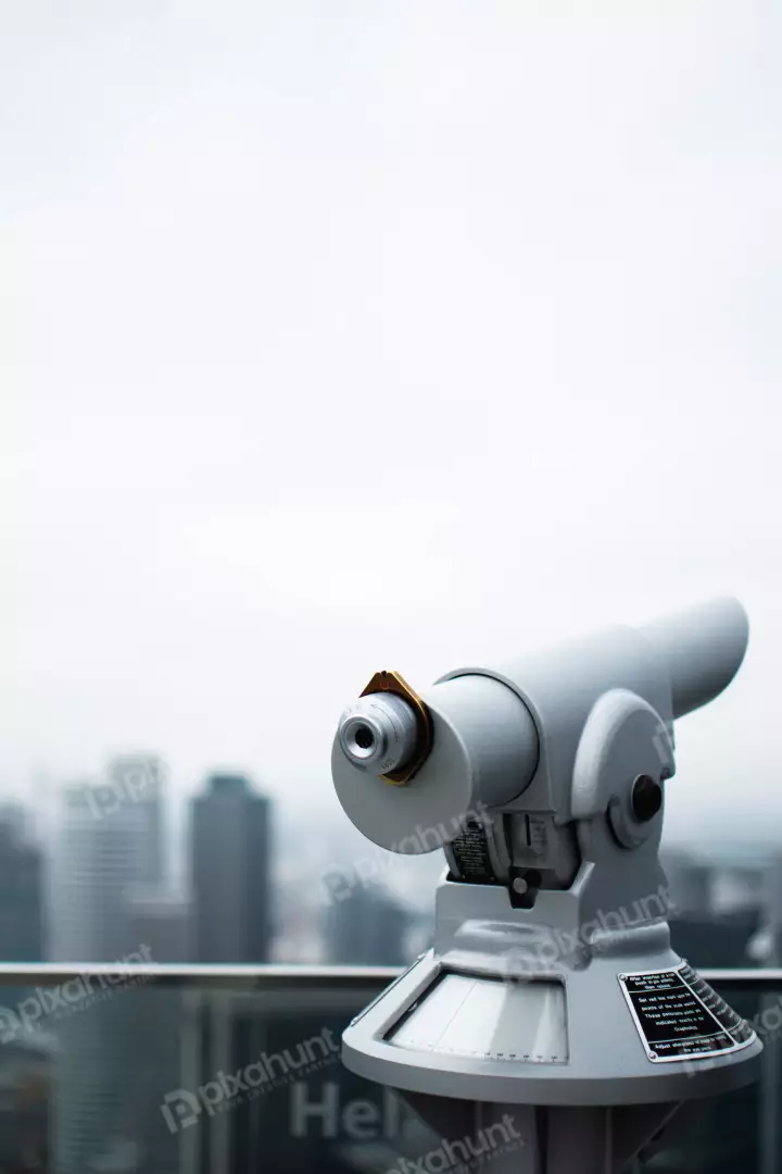 Free Premium Stock Photos telescope is pointed at a building in the distance